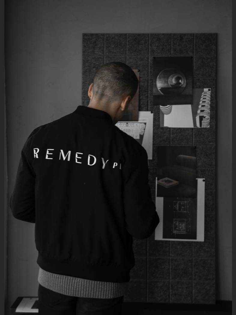 Dr. Jonathan Leary reviewing the Remedy Place design board